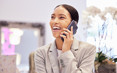 Image showing Happy woman smile while on a phone call with a contact while laughing and talking indoor at the store. Business woman networking while in a shopping mall with a mobile 5g smartphone for communication