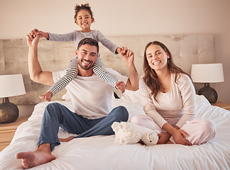 Image showing Fun family portrait, parents or girl playing in home bedroom for man, woman or girl in happy family. Smile, love or relax couple, bonding mother or father carrying child on shoulder in house interior