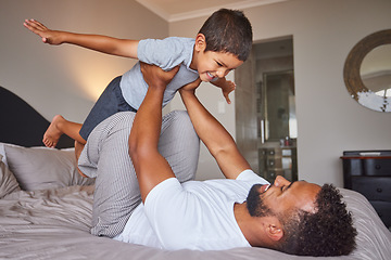 Image showing Father and kid on bed with fun games for child development in bedroom, home and house in the morning. Happy, love and care of dad and child with imagination, creative game and happiness together