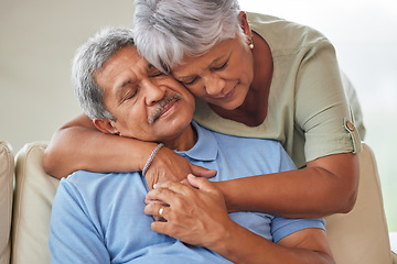 Image showing Sad or unhappy senior couple hug, comfort or support in a living room at home. Elderly husband suffering from depression problem after retirement consoled by his wife with love in the living room.