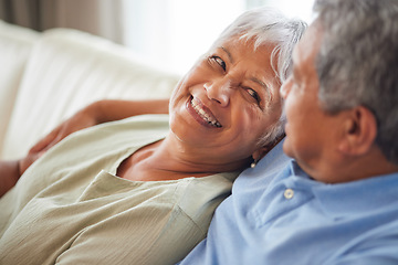 Image showing Happy, love and smile senior couple hugging relax and sitting on a couch at home. Man and woman lovers smiling and enjoying quality bonding together in the living room and having fun in the house