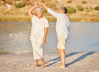 Image showing Sand, beach and dancing happy senior couple on summer retirement holiday travel or spring vacation by water. Love fun and elderly playful dancer people on outdoor sea, ocean and sunshine nature trip