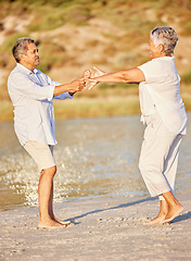 Image showing Beach, retirement and happy senior couple dancing on summer holiday or vacation by the sea. Love, commitment and romance dance with fun elderly man and woman on pension fund travel, trip and freedom