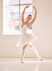 Image showing Dance, ballet and studio with a woman dancer training, practicing or dancing for a performance, recital or rehearsal. Artistic, perform or technique with a young female in a school for production art