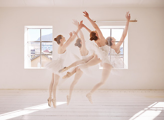 Image showing Dance, ballet and dancing ballerina jumping while having an out of body experience in an art studio. Fit, elegant and classical woman dancer training alone for a creative performance in a theater.