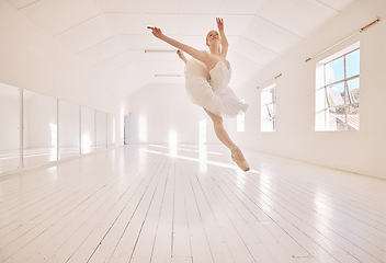 Image showing Ballet dance, jump and studio dancer dancing beautiful, elegant or classic performance in theater room. Stage artist, professional theatre ballerina and creative woman with energy moving with beauty