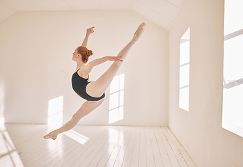 Image showing Ballet, jump and performance dance studio with young student. Dancer girl with energy in isolated classroom and moving in the air. Beautiful woman ballerina with strong body and stunning posture.