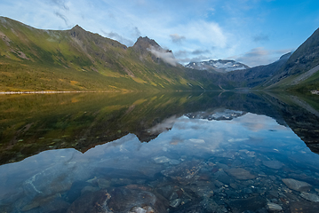 Image showing Tranquil Mountain Lake Reflection at Dusk in a Serene Valley