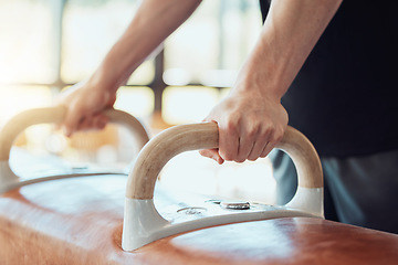 Image showing Hands of man gymnast training on pommel horse for fitness, strong balance and flexibility workout sport goal. Sports athlete on exercise or practice gym equipment for better cardio performance