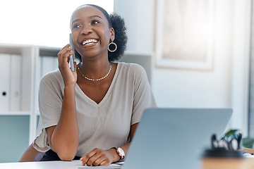 Image showing Happy business woman smile talking on phone call or young entrepreneur answering cellphone while sitting in front of work laptop in an office. Female executive smiling and laughing at a funny joke