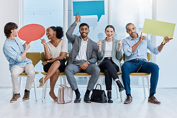 Image showing Speech bubbles, voice and vote by business people happy and sitting in an office. A diverse team of employees holding empty comment signs or icons for social media company communication