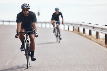 Image showing Bike, fitness and exercise with a man cyclist training on a bicycle for sport, health or exercise outside. Sports, wellness or fitness with a healthy athlete doing a workout for cardio and endurance