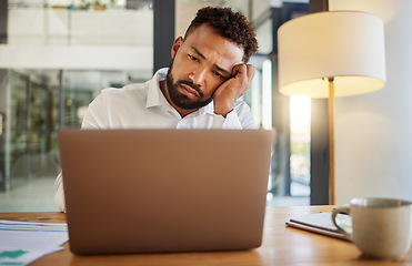 Image showing Stress, burnout and sad eyes of businessman on laptop working late on an email at house or home. Headache, mental health and disappointed worker working on finance, accounting or financial tax