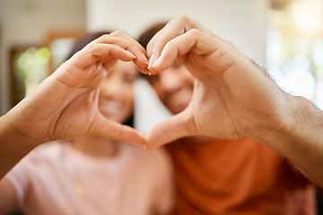 Image showing Love, heart and hands with a couple together in trust, health and support in their home. The hand of a happy, healthy and caring man and woman in a romantic relationship and unity in a new house