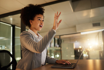 Image showing Surprised, shocked and excited business woman by a virtual or digital screen in an office while typing on a laptop. A female employee working late at night is amazed by a hologram at the workplace