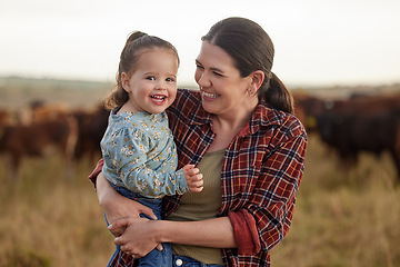 Image showing Mother and daughter, love and family on a farm as a cattle farmer and child in the farming or agricultural industry. Agriculture, sustainability and relationship with a woman and her girl outside