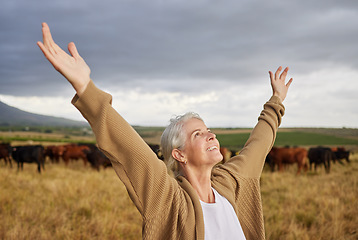 Image showing Sky, freedom and relax woman on countryside farm field standing on earth, field and grass with positive energy, wellness and peace. Nature, happy and smile on spiritual farmer girl looking at heaven