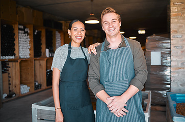 Image showing Ceo, wine people or couple and store workers in their distillery cellar background. Portrait, man and woman winery employees with happy smile working at warehouse, factory or vineyard industry