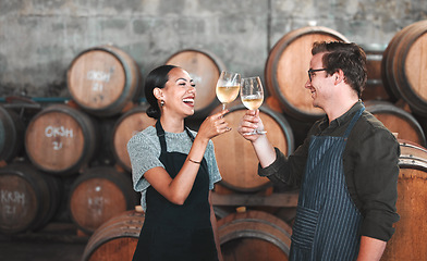 Image showing Wine, glass and toast with a couple who drink alcohol in a cellar, distillery or winery estate together. Farming, collaboration and teamwork with a man and woman drinking and doing a cheers as a team