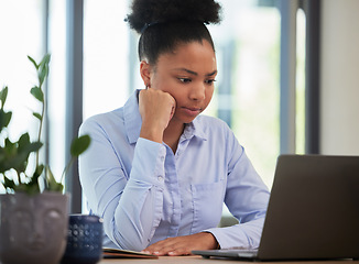 Image showing Serious, frustrated and thinking while waiting and working on a laptop with slow internet or wifi connection in an office. Black female entrepreneur looking worried about mistake or glitch online