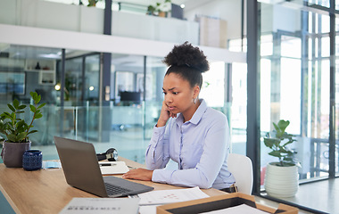 Image showing Stressed, confused or worried online finance manager with laptop reading, thinking or checking financial office report. Unhappy, concerned or anxious accountant making mistake or failing tax deadline