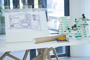 Image showing Architecture, design and blueprints on an office desk with plans and a building model for the construction industry. Architect office, planning and equipment in a modern and creative workplace