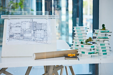 Image showing Architecture, blueprints and model building design in empty architectural company office. Vision engineering, real estate or residential planning with 3D structure for luxury apartment infrastructure