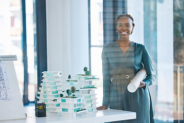 Image showing Architect, engineer and designer holding a blueprint with a positive mindset, mission and vision in an office. Portrait of a black woman standing next to 3D representation of proposed building design