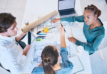 Image showing Teamwork, planning and discussing architects working on new building, house or shopping mall design top view. A team, colleagues or workforce with blueprints, designs and plans for a company project