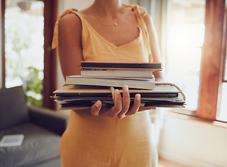 Image showing Recycle, books and notebook with woman cleaning or donating paper material in living room at home. Sustainability and eco cardboard waste management, for green living and clean future donation