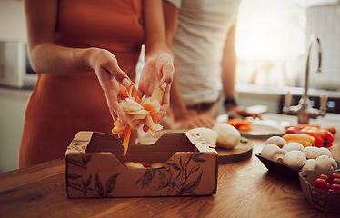 Image showing Recycle, sustainability and eco friendly cooking with a couple preparing food in the kitchen at home. Health, wellness and eating with a vegan man and woman recycling fresh, vegetarian produce