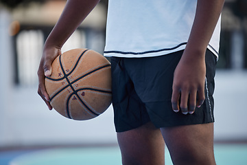 Image showing Basketball athlete ready for training, game and competition on sports court from below outdoor. Training, focus and fitness workout black man with motivation, mindset and goal to play, cardio and win