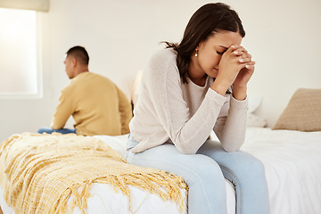 Image showing Uhappy, stressed and cheating while a couple sit on their bed feeling sad, upset and disappointed with sexual issues or communication problems. Heartbroken wife ignoring her partner after an argument