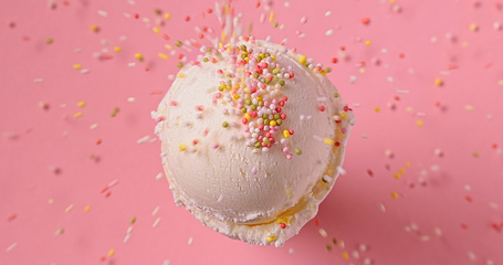 Image showing vanilla ice cream ball with falling sugar sprinkles