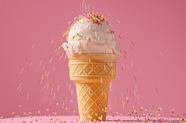 Image showing vanilla ice cream ball with falling sugar sprinkles