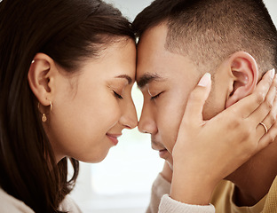 Image showing Dating, man and woman with foreheads against each other in a loving and affectionate closeup. In love, young male and female couple sharing a beautiful moment and smiling after their engagement.