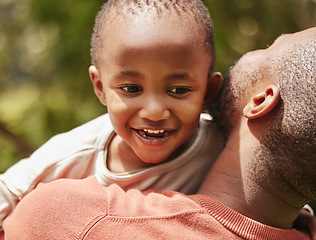 Image showing Happy, child and father in nature with smile of joy for quality time, holiday or weekend in the outdoors. Love, care and parent embracing his kid and having playful fun outside on a warm summer day.