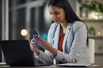 Image showing Stock market, phone app and finance planning for financial advisor, trader and investor working late at night. Smiling overtime worker reading, monitoring investment or cryptocurrency profit on tech