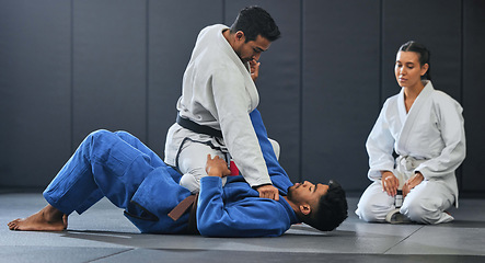 Image showing Karate student exercise, learning and training with mma coach teaching, sports and workout at gym. Wellness, sport and fitness athlete full mount take down in event, competition or dojo studio.