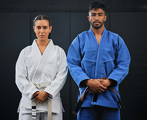 Image showing .Fitness, motivation and discipline karate training with a student and teacher standing proud in a center or dojo. Young woman learning defense, strength and endurance lesson from martial arts coach.