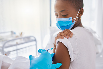 Image showing Vaccine, medicine and covid injection at a clinic by a young black woman wearing a covid19 mask. Ill, sick or unhealthy young female getting flu shot or coronavirus treatment at a hospital