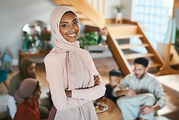 Image showing Muslim islam woman on EID with family at house in .Pakistan, Saudi Arabia or Iran to celebrate ramadan. Young girl smile in hijab with food in solidarity on islamic holiday together in family home