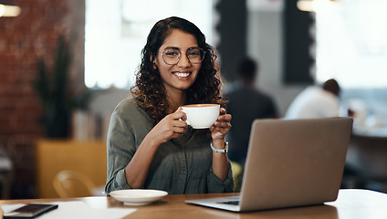 Image showing Creative entrepreneur with a laptop drinking coffee, browsing internet and searching startup business ideas in cafe. Portrait of smiling, happy and inspired remote blogger or student with online blog