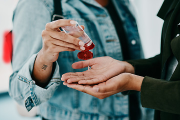 Image showing Closeup of woman cleaning themselves with hand sanitizer, medical and healthy during the pandemic. Health, hygiene and safety adults clean their hands to stop the spread of covid in office space.