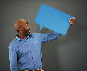 Image showing Review, communication and speech bubble with business man marketing, holding and advertising his message on a blank board. Poster, billboard and mock up with empty message board with copy space.