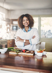 Image showing Wellness, cooking and a healthy lifestyle at home with a happy woman starting a weight loss journey. Portrait of a female smiling preparing a nutritious meal with organic vegetables in a kitchen