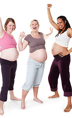 Image showing Happy pregnant and diversity women in studio or pregnancy portrait, mother to be with wellness success smile, white background mockup. Excited mom group friends with happiness and joy for baby birth