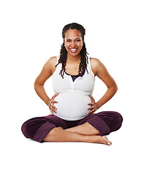 Image showing Portrait of a pregnant mother or woman in happy sitting and holding her baby bump isolated on a white background. Black female excited, smile and ready for a newborn child alone with cross legs.