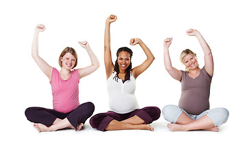 Image showing Pregnant, happy, and healthy, women sitting on the floor, arms raised in celebration of new life. Mothers, friends, and happiness during pregnancy, a group of future moms workout on white background