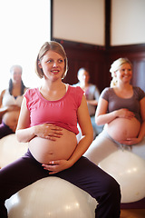 Image showing Exercise class, pregnant mother fitness and women workout at maternity wellness care studio. Happy woman with pregnancy belly on gym ball with the motivation for a strong and healthy body.